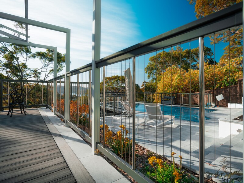 Stylish and safe aluminium pool fence with vertical cable, powder-coated for durability and beauty.